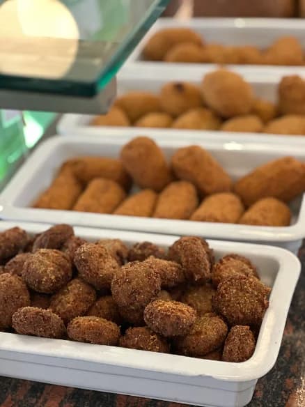 Trays of croquettes and stuffed olives