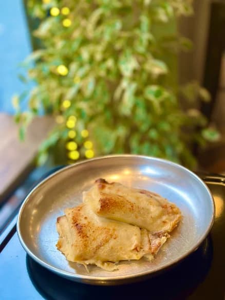 A portion of savoury bake served on a metal plate