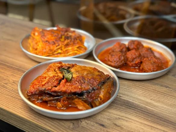 Three ready dishes on a wooden table