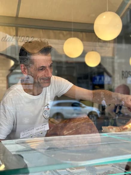 The deli counter seen from the window on via Plinio
